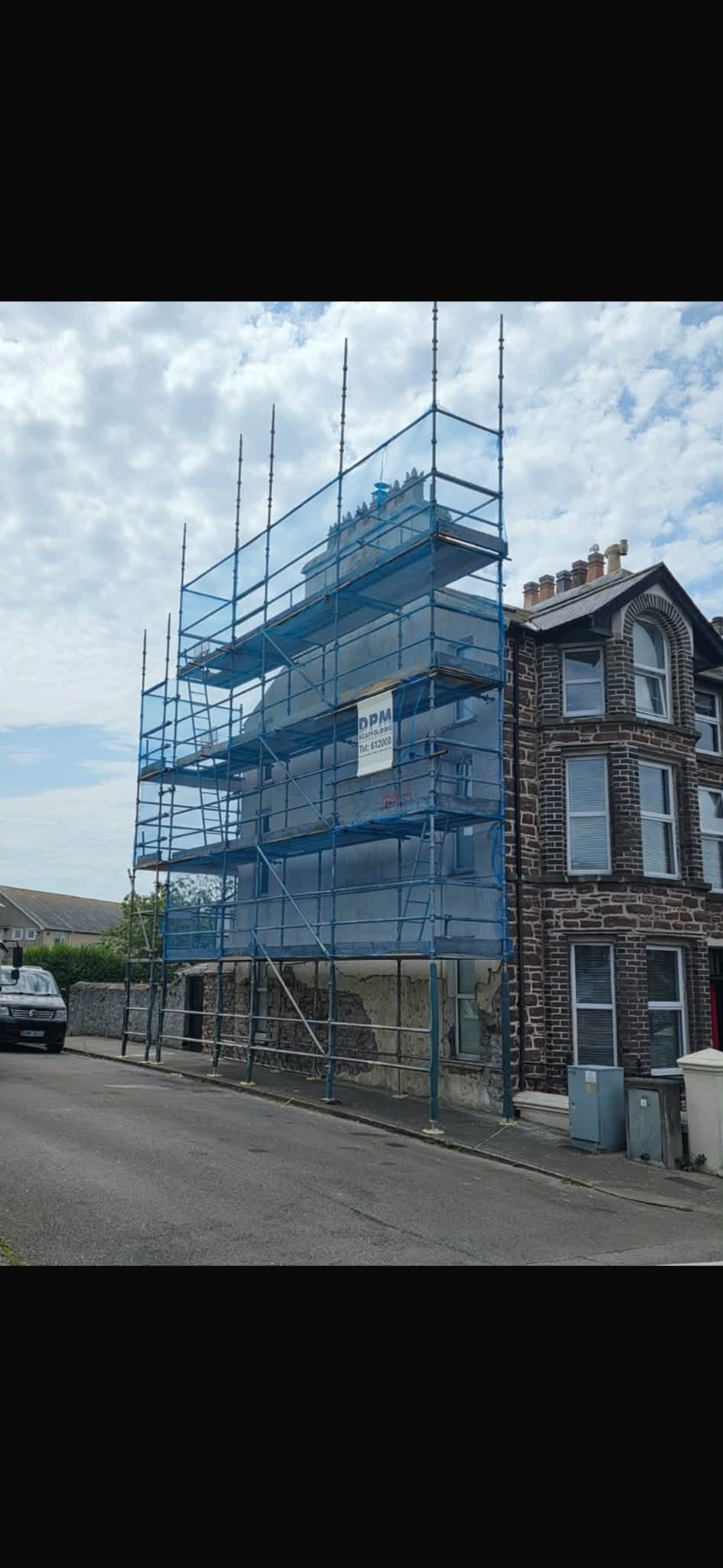 DPM scaffolding erected around a multi-storey residential building on the Isle of Man