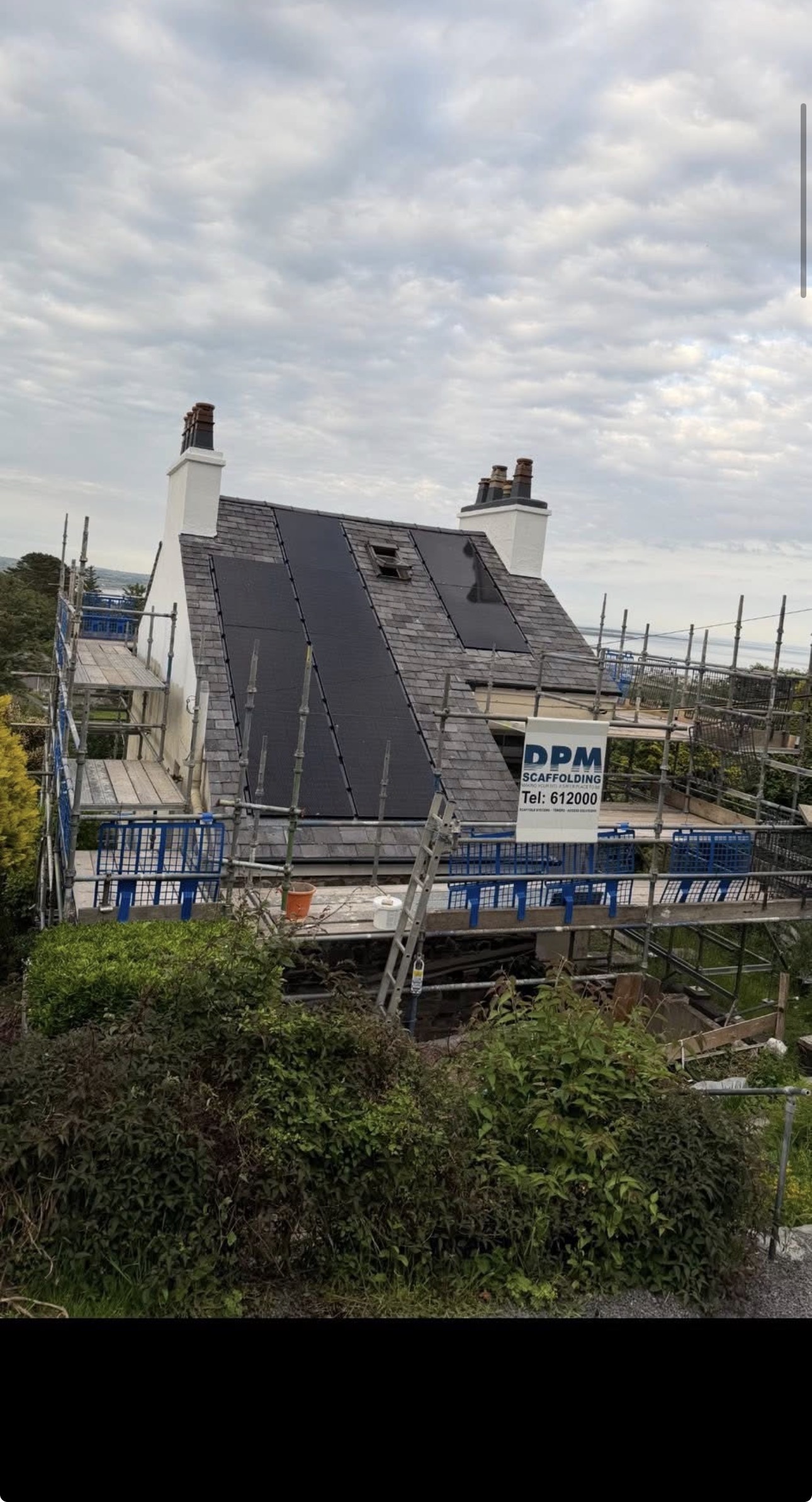 Scaffolding surrounding a property during roof works